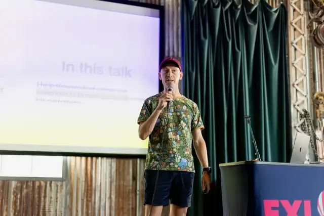 Lukas on stage presenting at CXL in Austin, 2024.