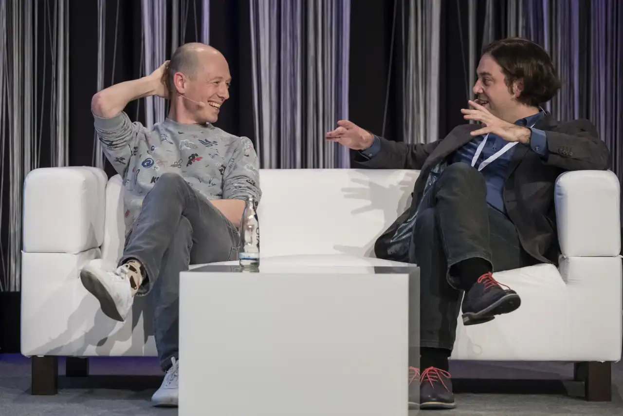 Lukas on stage answering questions from the audience at Predictive Analytics World in Berlin, 2017.